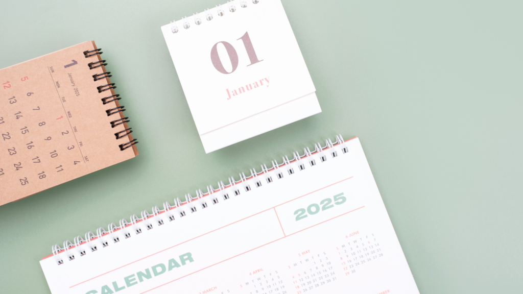 A calendar and notebook for the new year to plan new year's resolutions on January 1st