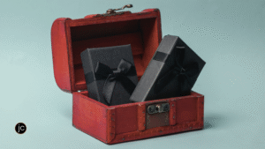 A red wooden treasure chest with wrapped presents inside, tied with bows, to signify a key to how to find joy in writing