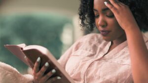 A woman enjoying some guilt-free Bible reading after realizing that daily Bible reading is not a requirement for Christian women
