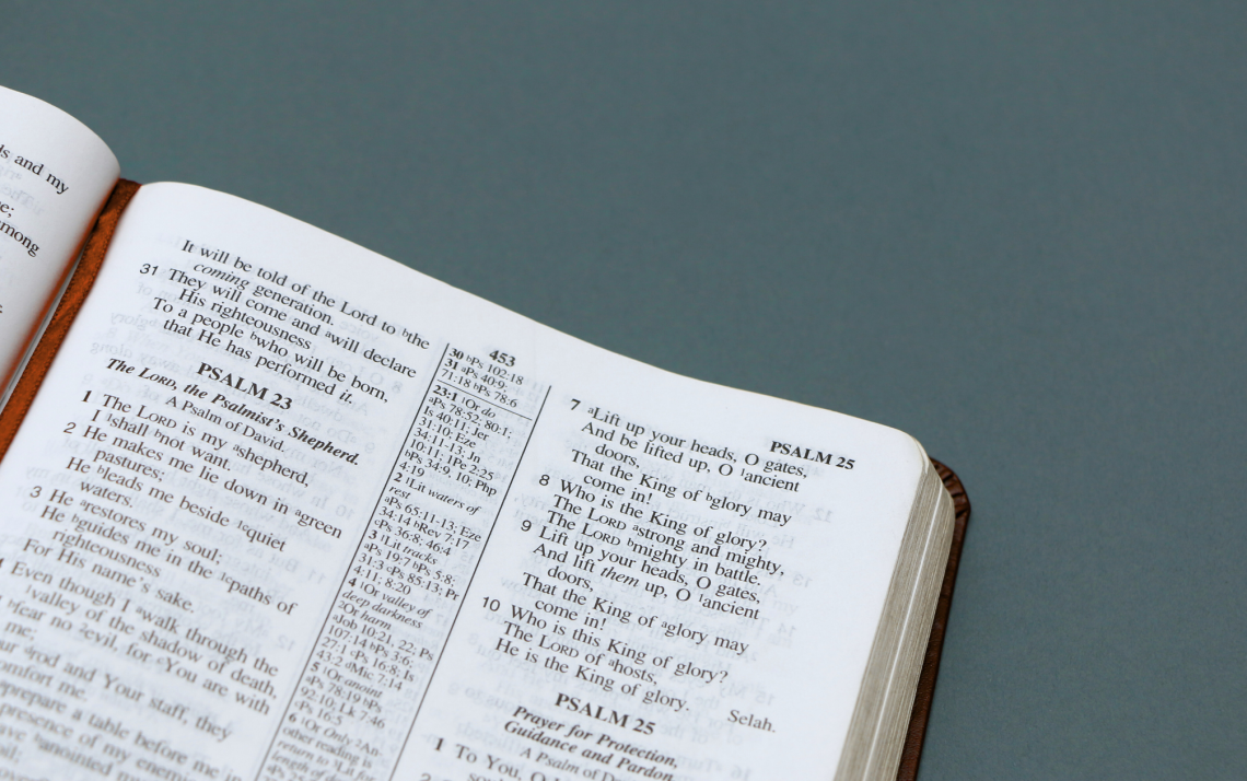 A Bible open to Psalm 23 with a cross-reference column