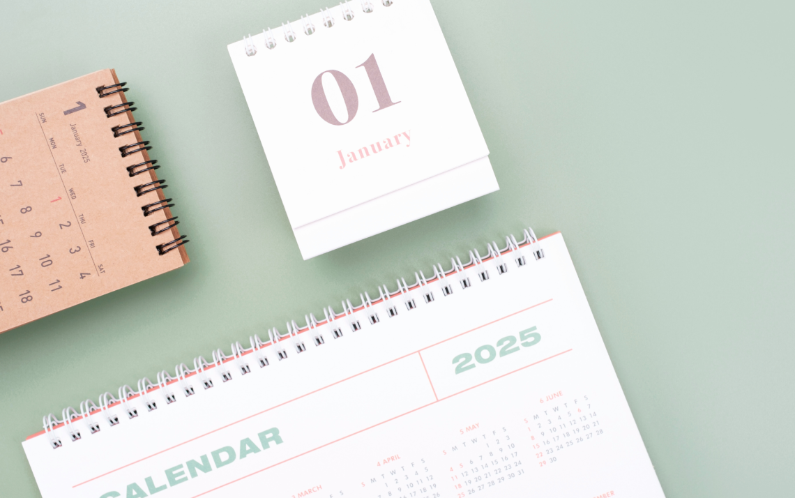 A calendar and notebook for the new year to plan new year's resolutions on January 1st